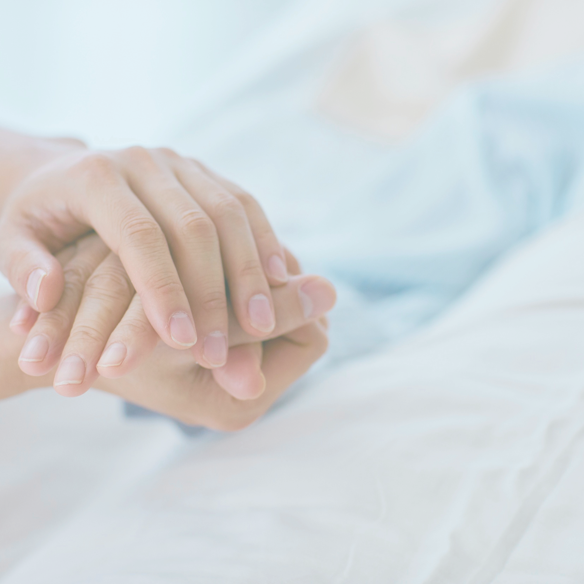 holding hands in medical setting